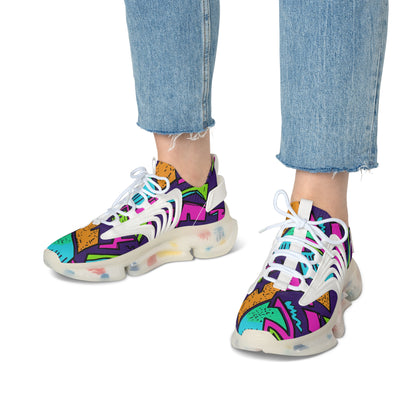 Colorful sneakers with abstract patterns worn with blue jeans on a white background