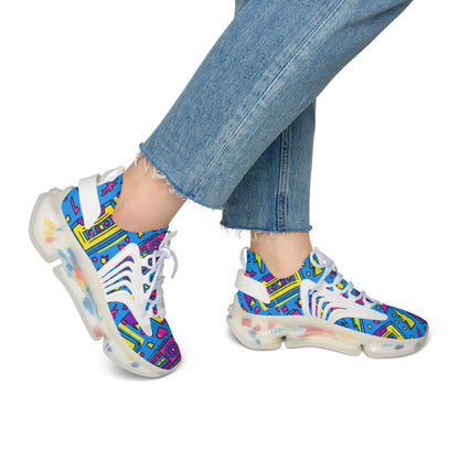 Colorful sneakers with a geometric pattern worn with blue jeans on a white background