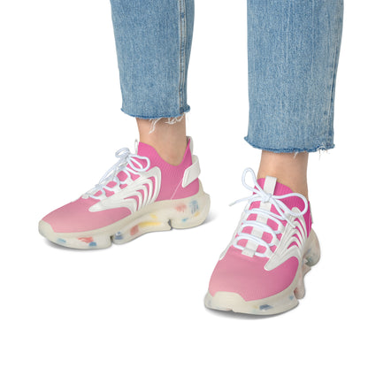 Pink sneakers with white laces worn with blue jeans on a white background